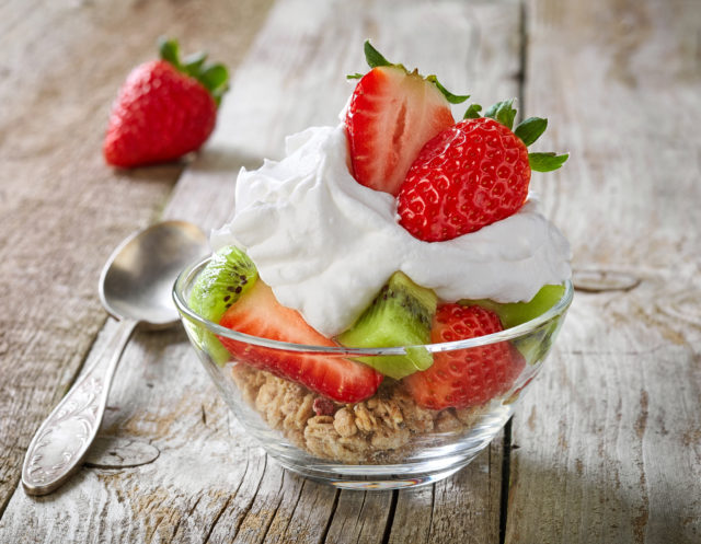 fruits and berries with whipped cream